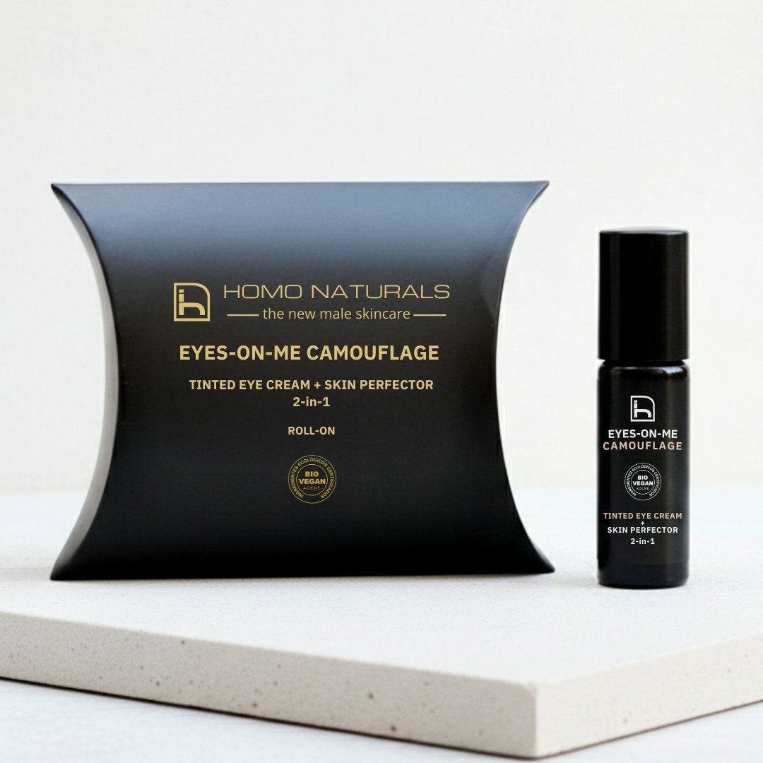 Roll-on contorno de ojos para hombre con cafeína y ácido hialurónico que reduce ojeras oscuras, bolsas bajo los ojos y signos de cansancio, tratamiendo 2-en-1 como corrector facial y antiojeras para piel masculina natural.